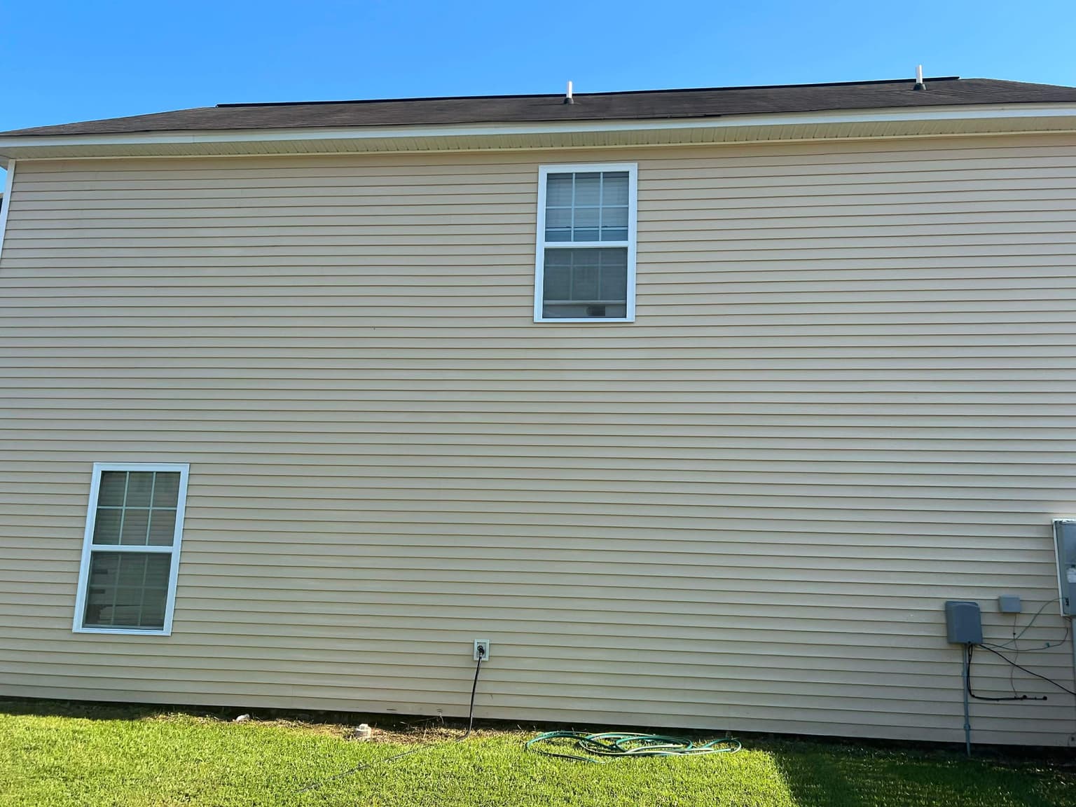 Pristine house exterior after gentle soft wash cleaning